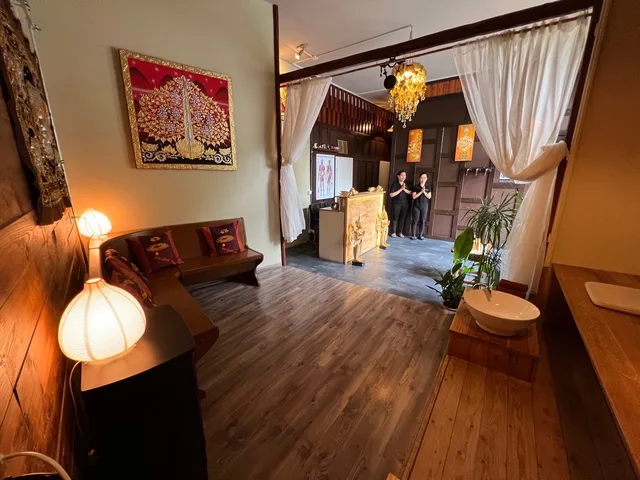 Warmly lit waiting area inside the Interlaken massage studio